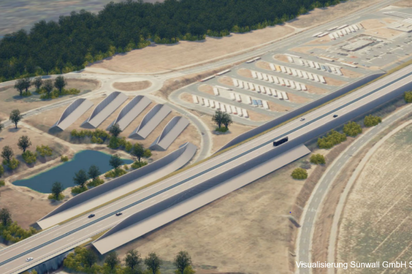 3D-Rendering einer Autobahn mit angrenzenden Parkplätzen und Industriezelten.