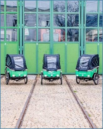 3 Lastenfahrräder von vorne, grün